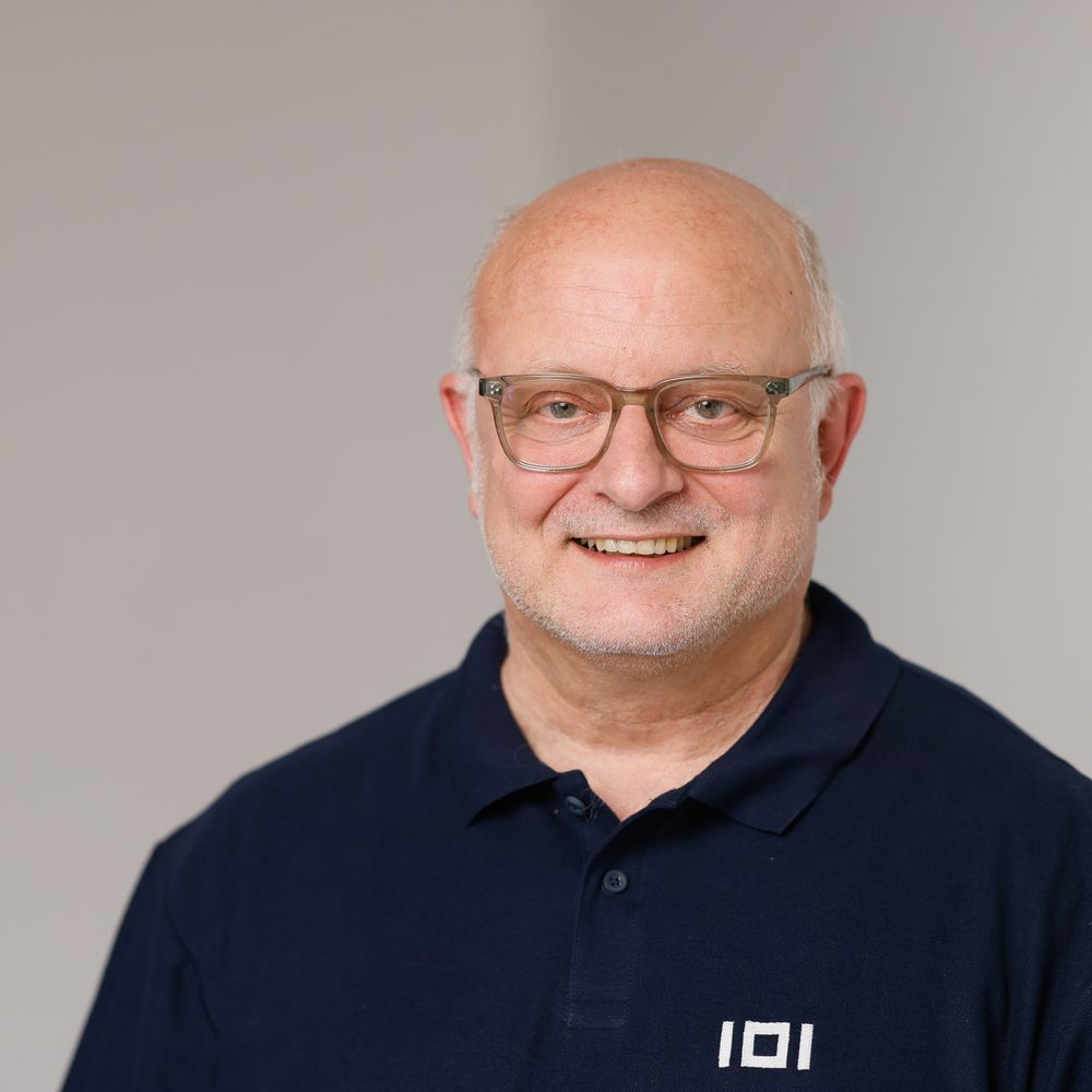 Thomas Marquardt, Managing Director and CTO of IO Integrated, wearing a navy polo shirt with the IOI logo